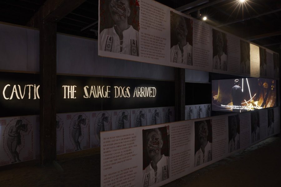 Colectivo Ayllu installing don’t blame us for what happened, Colectivo Ayllu, 2019-2020, mixed media installation with print walls, video projections, audio and altar, dimensions variable. Installation progress view (2020) for the 22nd Biennale of Sydney, Artspace. Courtesy the artists. Photograph: Zan Wimberley