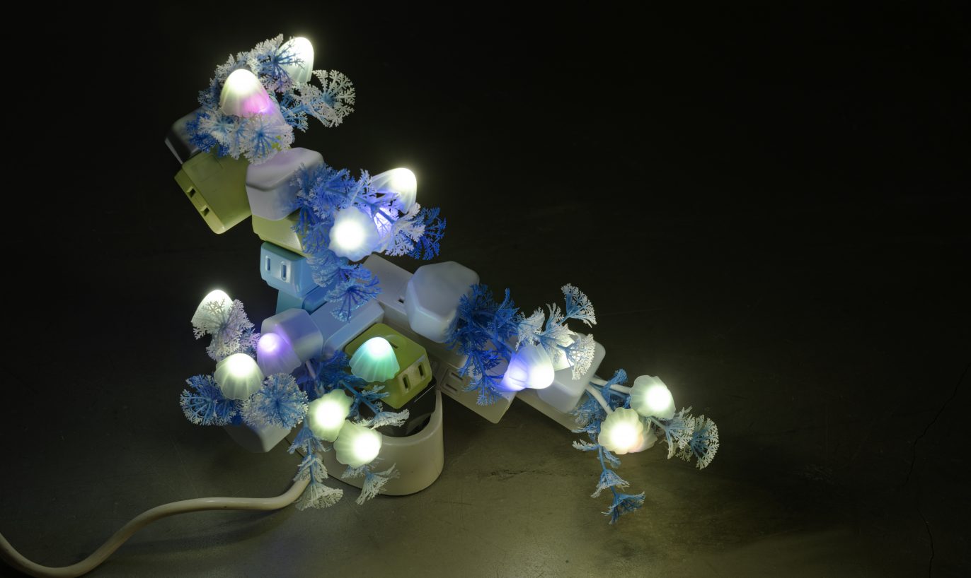 Trevor Yeung, Night Mushroom in Shade (table) (2022), 
night lamp, plug adaptors, 25.5 x 35 x 18 cm. Photo: Blindspot Gallery. Courtesy the artist and Blindspot Gallery, Hong Kong. 