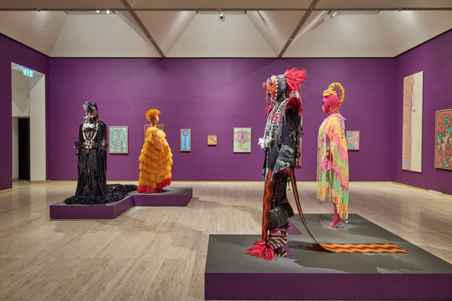 Foreground (left to right): Pacific Sisters, Kaitiaki with a K, 2017; Tapu Tinana, 2019. Courtesy the artists; MuruMoa, 2023. Commissioned by the Biennale of Sydney with generous support from a grant from Open Society Foundations, assistance from James Roth and Susan Sue Acret, and assistance of the Chartwell Charitable Trust; Sup’ia Suga, 2023. Commissioned by the Biennale of Sydney with generous support from a grant from Open Society Foundations, generous assistance from Creative New Zealand, generous assistance from James Roth and Susan Sue Acret, and assistance of the Chartwell Charitable Trust. Courtesy the artists © Pacific Sisters. Background (left to right): I Gusti Ayu Kadek (Murni), Aku Perempuan berbadan kuat, 2000; Asik naik ke bulan, 1998; Belum bisa lepas 2004. Presentation at the 24th Biennale of Sydney was made possible with generous support from Gajah Gallery. Courtesy Gajah Gallery; Merangsan 2002. Collection and courtesy of Konfir Kabo; Hayalan 18 mei, nd; Main Speak Bola, 1999; Kembaranku, 2002. Presentation at the 24th Biennale of Sydney was made possible with generous support from Gajah Gallery. Courtesy Gajah Gallery. © I Gusti Ayu Kadek Murniasih. Installation view, 24th Biennale of Sydney, Ten Thousand Suns, 2024, Art Gallery of New South Wales. Photograph: Christopher Snee.