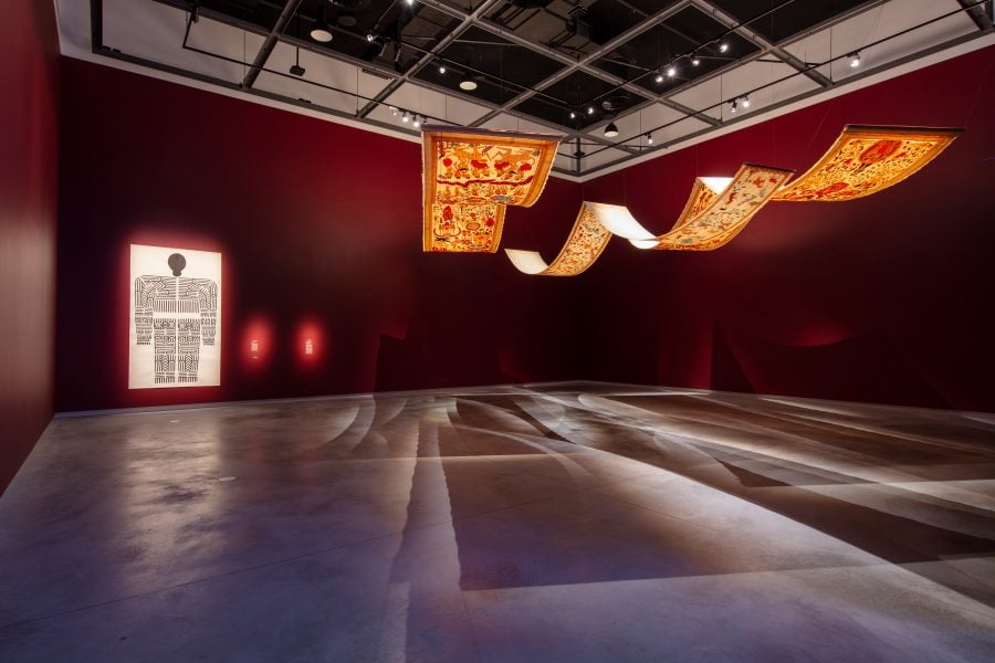 Left to right: Mangala Bai Maravi, Baiga Godna Indian Tribe, 2024. Commissioned by the Biennale of Sydney and the Fondation Cartier pour l’art contemporain. Courtesy the Baiga Tribe. Artist Assistant: Amit Arjel-Sharma. © Baiga Tribe. Citra Sasmita, Timur Merah Project X: Bedtime Story, 2023. Commissioned by the Biennale of Sydney with generous support from the Australia-Indonesia Institute; Timur Merah Project IV: Tales of Nowhere 2020. Commissioned by UOB for Children Art Space MACAN Museum Jakarta, Indonesia 2020. Courtesy the artist and Yeo Workshop, Singapore © Citra Sasmita. Installation view, 24th Biennale of Sydney, Ten Thousand Suns, 2024, Chau Chak Wing Museum. Photograph: David James.