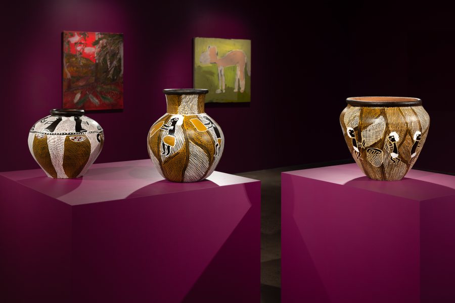 Foreground (left to right): Dhopiya Yunupiŋu, Galiku, 2023; Galiku, 2023; Galiku, 2023. Courtesy the artist, Sullivan+Strumpf, Sydney, and Buku-Larrŋggay Mulka Centre, Yirrkala © Dhopiya Yunupiŋu. Background (left to right): Wendy Hubert, Afghans Bought the Palms, 2021. Courtesy the artist and Juluwarlu Art Group, Roebourne © Wendy Hubert. Doreen Chapman, Untitled (Camel), 2020. Presentation at the 24th Biennale of Sydney was made possible with generous support from the Fondation Cartier pour l’art contemporain and with generous assistance from the Australian Government through Creative Australia, its principal arts investment and advisory body. Courtesy the artist and Spinifex Hill Studio, South Hedland © Doreen Chapman. Installation view, 24th Biennale of Sydney, Ten Thousand Suns, 2024, UNSW Galleries. Photograph: Jacquie Manning.