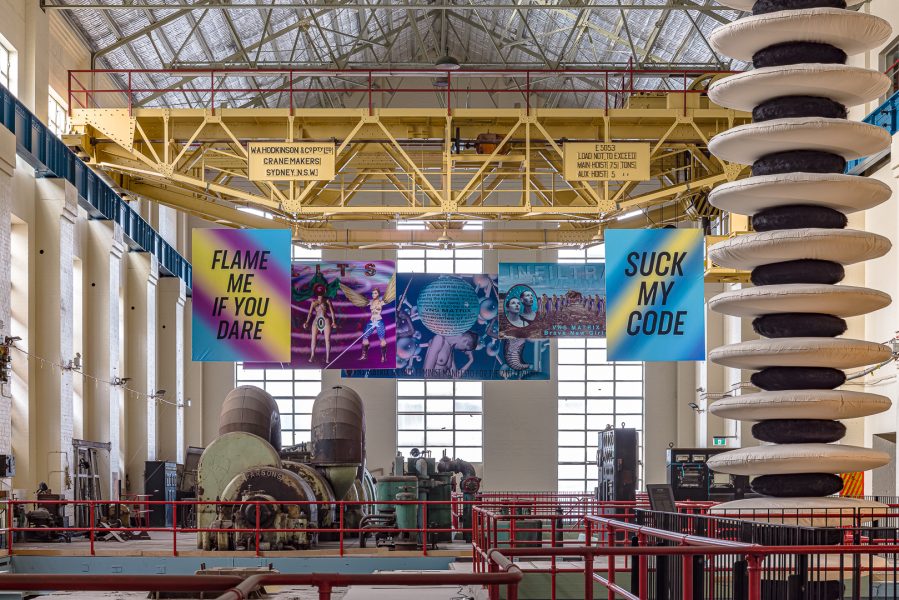 Left to right: VNS Matrix, FLAME ME IF YOU DARE, 1993 (renamed and reprinted for exhibition 2024); DNA Slits, 1993 (renamed and reprinted for exhibition 2024); A Cyberfeminist Manifesto for the 21st Century, 1991 (reprinted for exhibition 2024); Infiltrate, 1994 (reprinted for exhibition 2024); SUCK MY CODE, 1996 (reprinted for exhibition 2024). Presentation at the 24th Biennale of Sydney was made possible with generous assistance from the Australian Government through Creative Australia, its principal arts investment and advisory body and generous assistance from Arts South Australia. Courtesy the artists © VNS Matrix. Eric-Paul Riege, ...oo-O-oo-O-oo-O-oo-O-oo-O-oo-O-oo-O-oo-O-oo-O-oo-O-oo…, 2023 (detail). Commissioned by the Biennale of Sydney and the Foundation Cartier pour l’art contemporain with generous support from Terra Foundation for American Art. Courtesy the artist and Bockley Gallery, Minneapolis and STARS Gallery, Los Angeles © Eric-Paul Riege. Installation view, 24th Biennale of Sydney, Ten Thousand Suns, 2024, White Bay Power Station. Photograph: Document Photography.