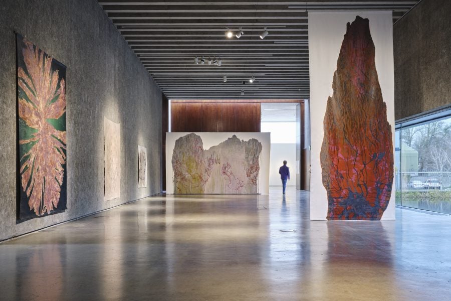Deirdre O’Mahony, Erratics and WRAP (1996 – 1999) as part of Between A Rock And A Hard Place (installation view), 2025, Acrylic copolymer, pigment, stone dust on canvas, dimensions variable. Photograph: Ros Kavanagh. Courtesy of the artist and VISUAL Carlow.