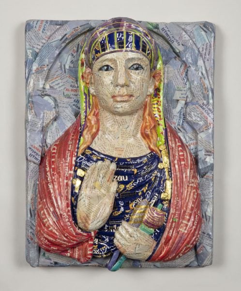Michael Rakowitz, May The Obdurate Foe Not Be In Good Health (Limestone Funerary Bust), 2020, Middle Eastern food packaging and newspaper, with glue on panel, 56 x 43 x 16cm. Photograph: Courtesy of the artist and Green Art Gallery.