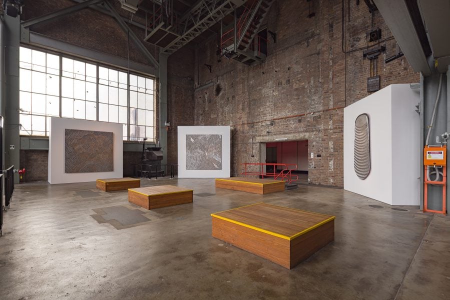 Left to right: Gunybi Ganambarr, Ŋaymil font, 2024. Dhuwa spring, 2025. Mundatjŋu, 2024. Commissioned by the Biennale of Sydney and the Fondation Cartier pour l’art contemporain. Courtesy of the artist; Buku-Larrŋgay Mulka Art Centre; and Yirrkala, Northern Territory © Gunybi Ganambarr. Installation view, 25th Biennale of Sydney, Rememory, 2026, White Bay Power Station. Photograph: Document Photography. 