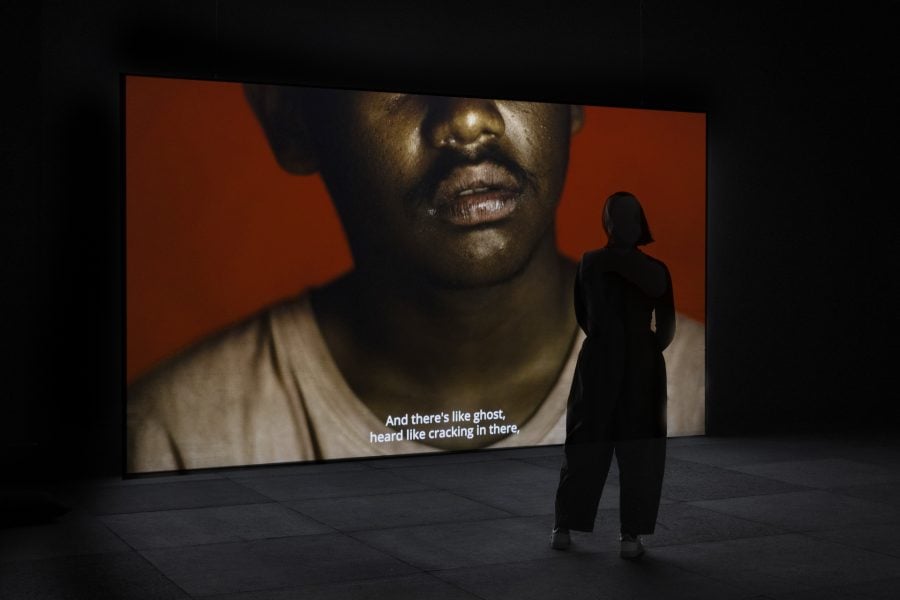 Behrouz Boochani , Hoda Afshar, Vernon Ah Kee, Code Black/Riot, 2025.Commissioned by the Biennale of Sydney with generous support from the Australian Government through Creative Australia, its principal arts investment and advisory body, and University of Melbourne, and generous assistance from the Queensland Government through Arts Queensland. Supported by First Nations-led advocacy organisation Change the Record with additional support from YETI (Youth Empowered Towards Independence). Courtesy of the artists and Milani Gallery, Meanjin (Brisbane) © Hoda Afshar and Vernon Ah Kee. Installation view, 25th Biennale of Sydney, Rememory, 2026, Campbelltown Arts Centre. Photograph: Silversalt Photography. 