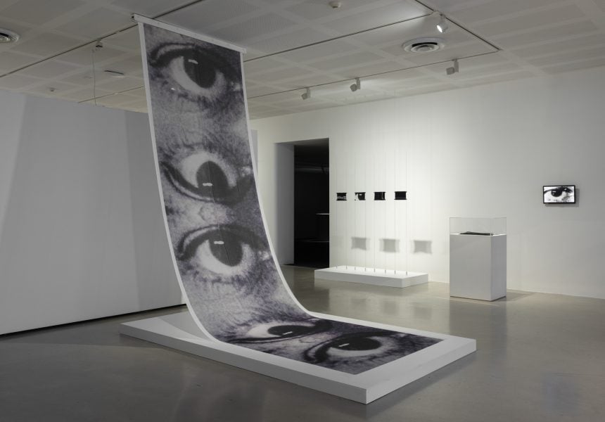 Left to right: Nasri Sayegh, Les Yeux Sans Visage (Eyes without a face), 2025. Commissioned by the Biennale of Sydney and Rubaiya Qatar, Qatar Museums with generous assistance from Australian Tapestry Workshop. Nasri Sayegh, Retinæ – 4, Retinæ – 3, Retinæ – 2, Retinæ – 1, 2025. Commissioned by the Biennale of Sydney and Rubaiya Qatar, Qatar Museums with generous assistance from Australian Tapestry Workshop and Weaver, David Pearce. Nasri Sayegh, Stitch it, black!, 2025. Commissioned by the Biennale of Sydney and Rubaiya Qatar, Qatar Museums with generous assistance from Australian Tapestry Workshop. Nasri Sayegh, Tears Naturale, 2025. Commissioned by the Biennale of Sydney and Rubaiya Qatar, Qatar Museums. Courtesy of the artist © Nasri Sayegh. Installation view, 25th Biennale of Sydney, Rememory, 2026, Campbelltown Arts Centre. Photograph: Silversalt Photography.