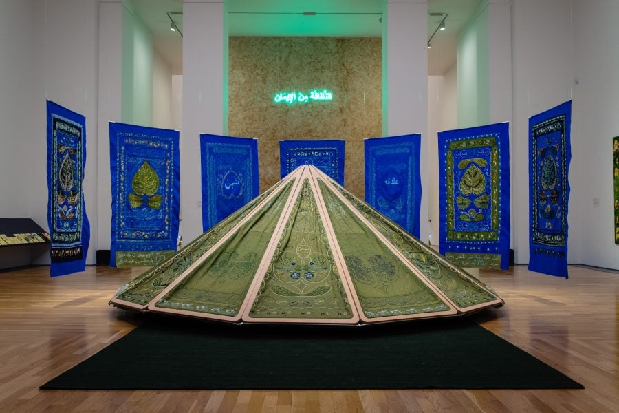 Mounira Al Solh, A night hour, as long as night, 2023, textile on wooden structure, 240 x 600 x 600 cm. Installation view, Artes Mundi 10, 2023, The National Museum Cardiff, Wales, United Kingdom. Photograph: Polly Thomas.  Courtesy of the artist and Sfeir-Semler Gallery Beirut/Hamburg. © Mounira Al Solh