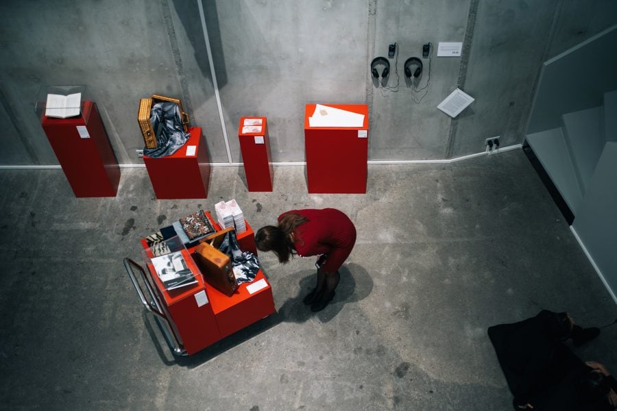 Chang Wen-Hsuan, ___'s Autobiography (installation view) (from The Compendium of Autobiographies series), 2016-2019, audio guides, documents, fabrics, counterfeit money, suitcases, books, knife, pedestals, trolley, dimensions variable. Photograph: graysc.de. Courtesy of the artist. Copyright ©️ Times Art Center Berlin.